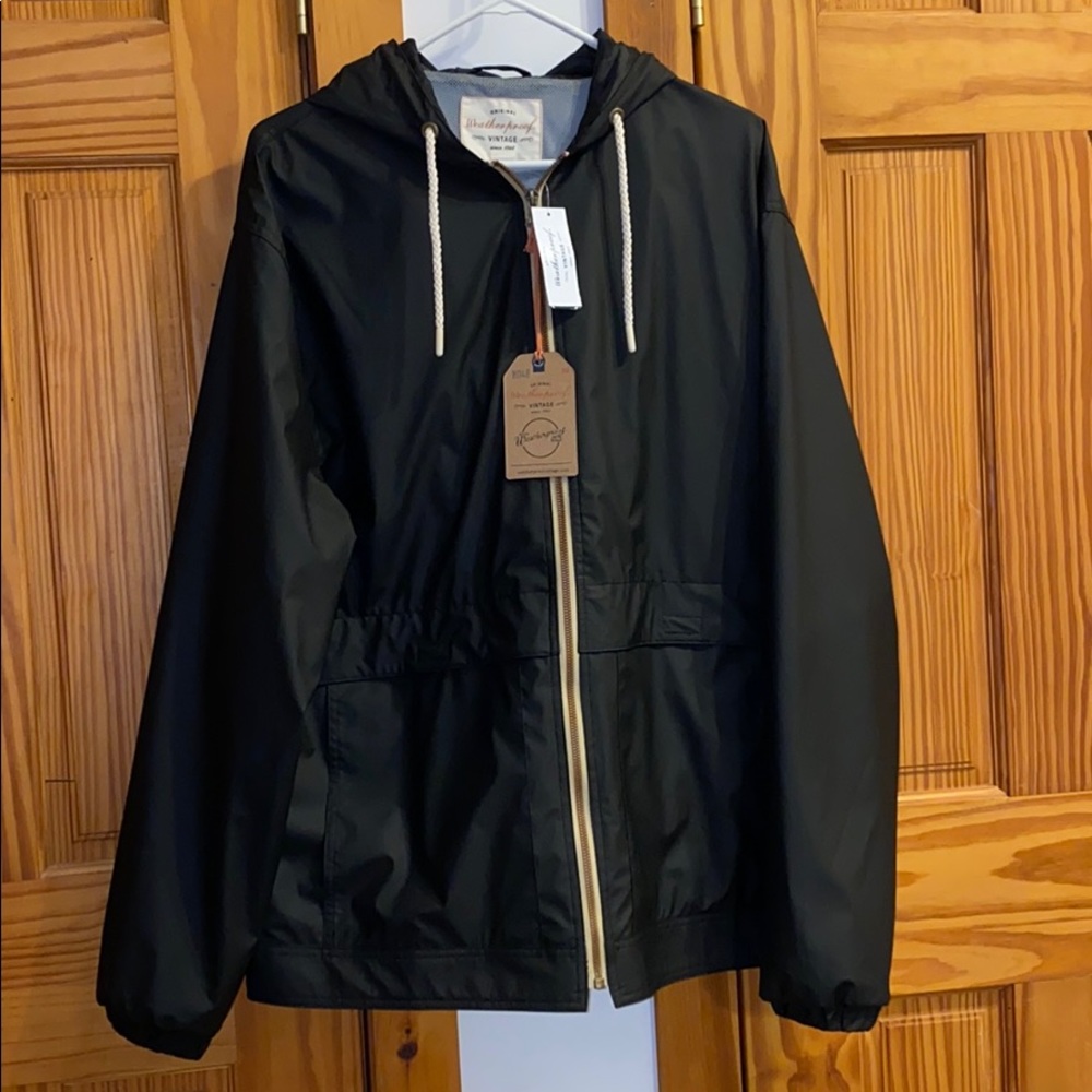 Large black weatherproof rain jacket